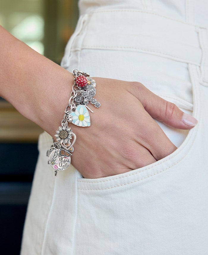 Woman wearing charm bracelets